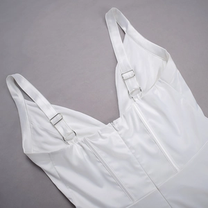 Detail of adjustable silver buckles and invisible zipper on white satin dress back