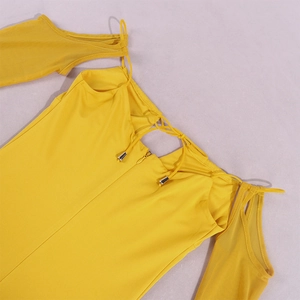 Detail of yellow off-shoulder dress with sheer mesh sleeves and back zipper