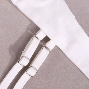 Detailed close-up of white fabric strap with adjustable silver metal buckle detail
