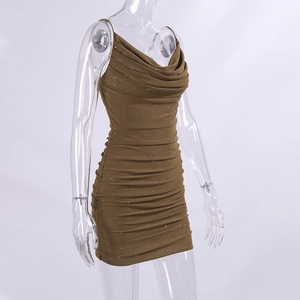 Close-up of bronze sequined dress with cowl neck and ruched details for party wear