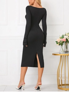 Detail view of the back slit design on a black bodycon midi dress with finger hole sleeves