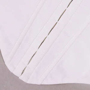 Detailed close-up of white corset top featuring fishbone support and hook-and-eye closure