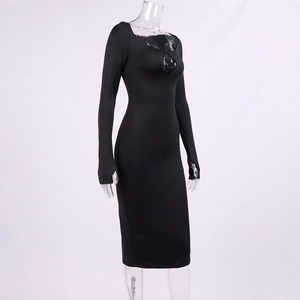 Detail of front cutout neckline and square collar on a black long sleeve bodycon dress