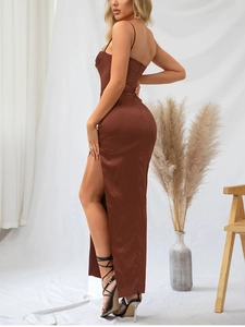 Detail of elegant dark brown satin maxi dress showing side slit and high-quality fabric
