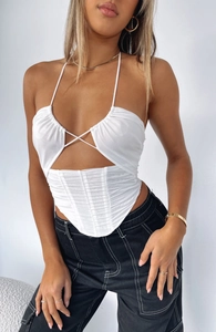 Detail of white halter neck corset top featuring mesh ruching and structured boning