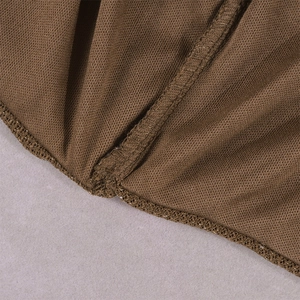 Detailed close-up of brown knit fabric showing fine mesh texture and flat seam stitching