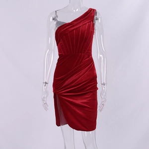 Detail of red velvet off-shoulder dress featuring ruched waist and sequin lining
