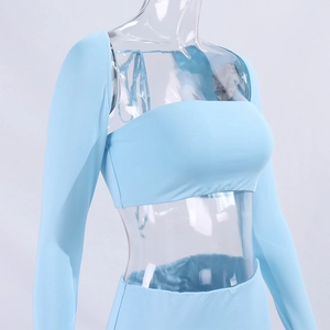 Detailed view of light blue three-piece knit set with shrug and skirt on a mannequin