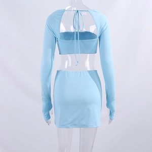 Detailed back view of light blue two-piece set with lace-up open back top and mini skirt