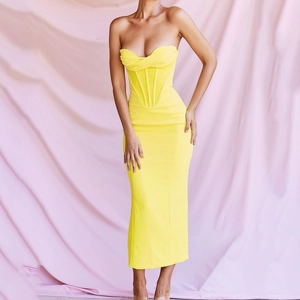 Elegant bright yellow corset maxi dress with off-shoulder neckline and bodycon silhouette
