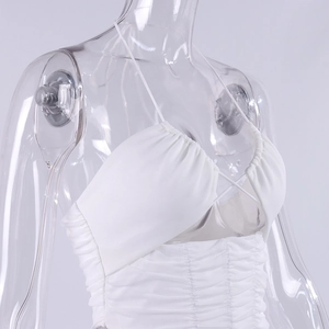 Detail of white halter neck crop top showing intricate mesh pleats and ruched texture