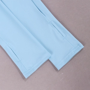 Detailed view of sky blue elastic knit sleeves with functional thumbhole design