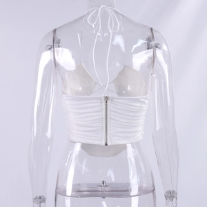 Back view of white halter top featuring ruched fabric and a functional metal zipper