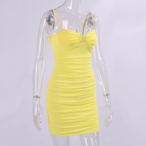 Detail of yellow bodycon mesh dress featuring ruched fabric and thin shoulder straps