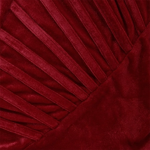 Detail of burgundy velvet fabric with structured parallel pleats and smooth texture