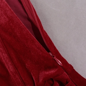Detail of wine red velvet fabric with high-quality invisible zipper closure on the dress
