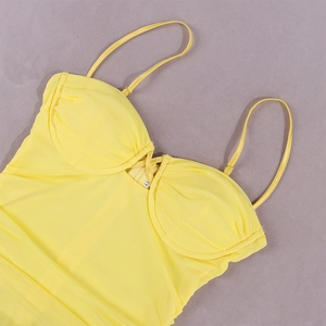 Close-up of yellow mesh dress featuring ruched bust cups and thin adjustable straps