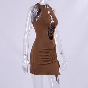Detail view of brown sleeveless dress featuring lace-up cutout and side ruching texture