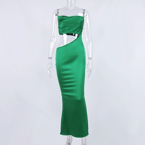 Detail of emerald green satin dress featuring unique waist cutout and ruched bust design