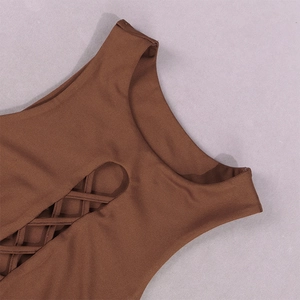 Detailed close-up of dark brown hollow-out design with criss-cross lace-up and ruching fabric