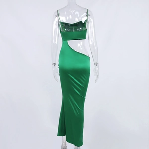 Detail of emerald green satin dress featuring an open back with cutout design