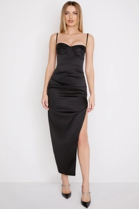 Detailed close-up of sexy black satin slit maxi dress showing fabric texture and pleats