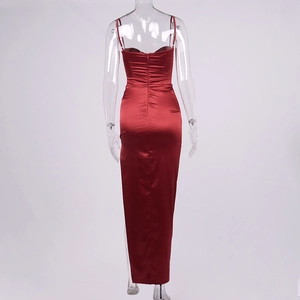 Close-up of invisible back zipper on red satin bodycon maxi dress with smooth texture