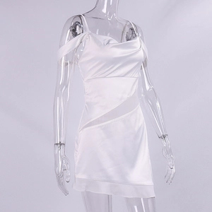 Detailed view of white satin dress featuring cowl neck and side mesh cutout design