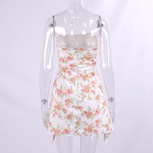 Detail of floral backless dress showing hidden zipper and irregular draped hemline