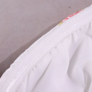 Detail showing non-slip silicone strip and double stitching on floral print dress