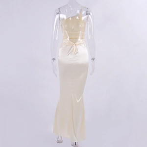 Detail of satin fishtail maxi dress with backless design and elegant knot drapery