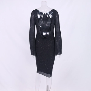 Detail view of sparkly black mesh dress with deep U-back cut and tie-back design