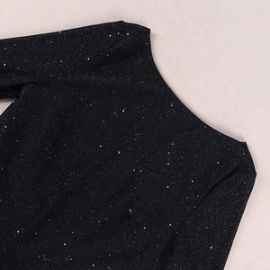 Close-up of black mesh dress collar with sparkling colorful sequins and texture detail