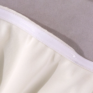Detailed close-up of cream satin fabric featuring internal anti-slip silicone strip