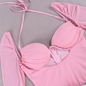 Detail of pink mesh long sleeve dress with halter neck and pleated cup design