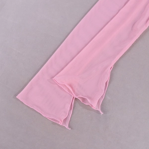 Close-up of pink sheer mesh dress sleeve detail featuring delicate ruffle lettuce edges