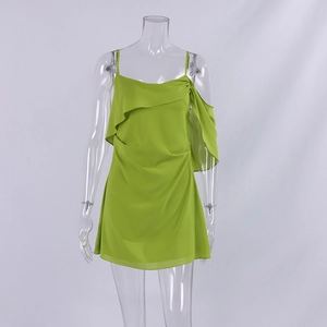 Detail of avocado green chiffon dress featuring delicate ruffles and thin shoulder straps