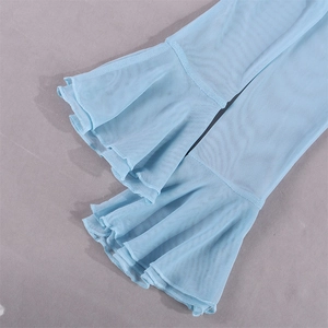 Detail showing light blue mesh fabric with flared ruffled cuffs and delicate textures