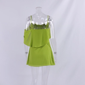 Detail of lime green chiffon dress back with ruffle layers and thin spaghetti straps