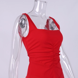 Detail of red square neck sleeveless dress featuring ruched fabric and stretch design