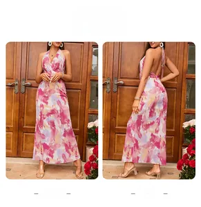 Front and back detail of a floral halter maxi dress with a deep V-neck and open back design