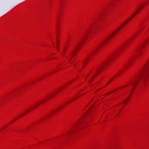 Macro view of the elastic red chiffon dress fabric with detailed ruched texture design