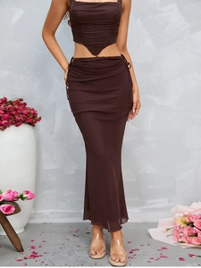 Detail of dark brown mesh maxi skirt with adjustable side drawstring and elegant ruching