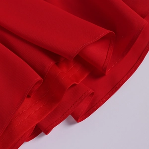 Detail shot of the red cotton chiffon fabric with premium double-stitch hem finish