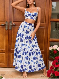 Detail of blue floral print camisole and tiered maxi skirt with pleated vacation style