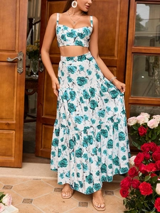 Detail of floral two-piece set featuring cropped halter top and tiered maxi skirt