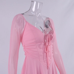 Detail of pink long sleeve dress with V-neck, mesh sleeves and side ruched drawstring