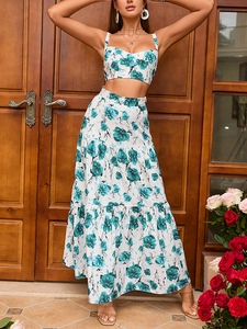 Detail of floral two-piece set featuring a cropped top and layered boho maxi skirt