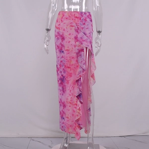 Detail of summer high slit skirt with pink tie-dye print and cascading ruffles