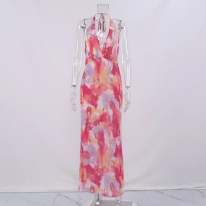 Detail of colorful abstract print and deep V-neck halter design on mesh maxi dress